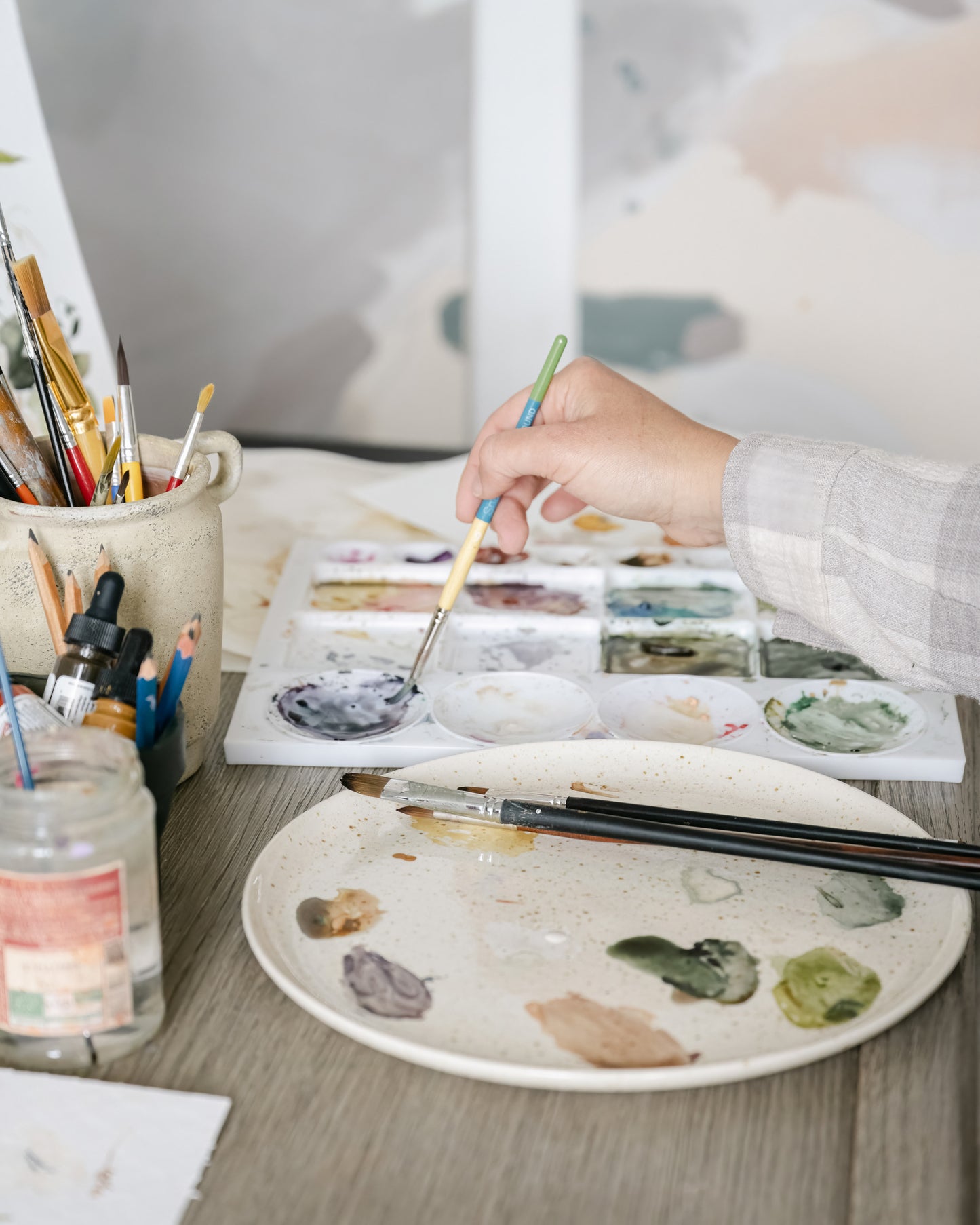 Artist painting with watercolour paints