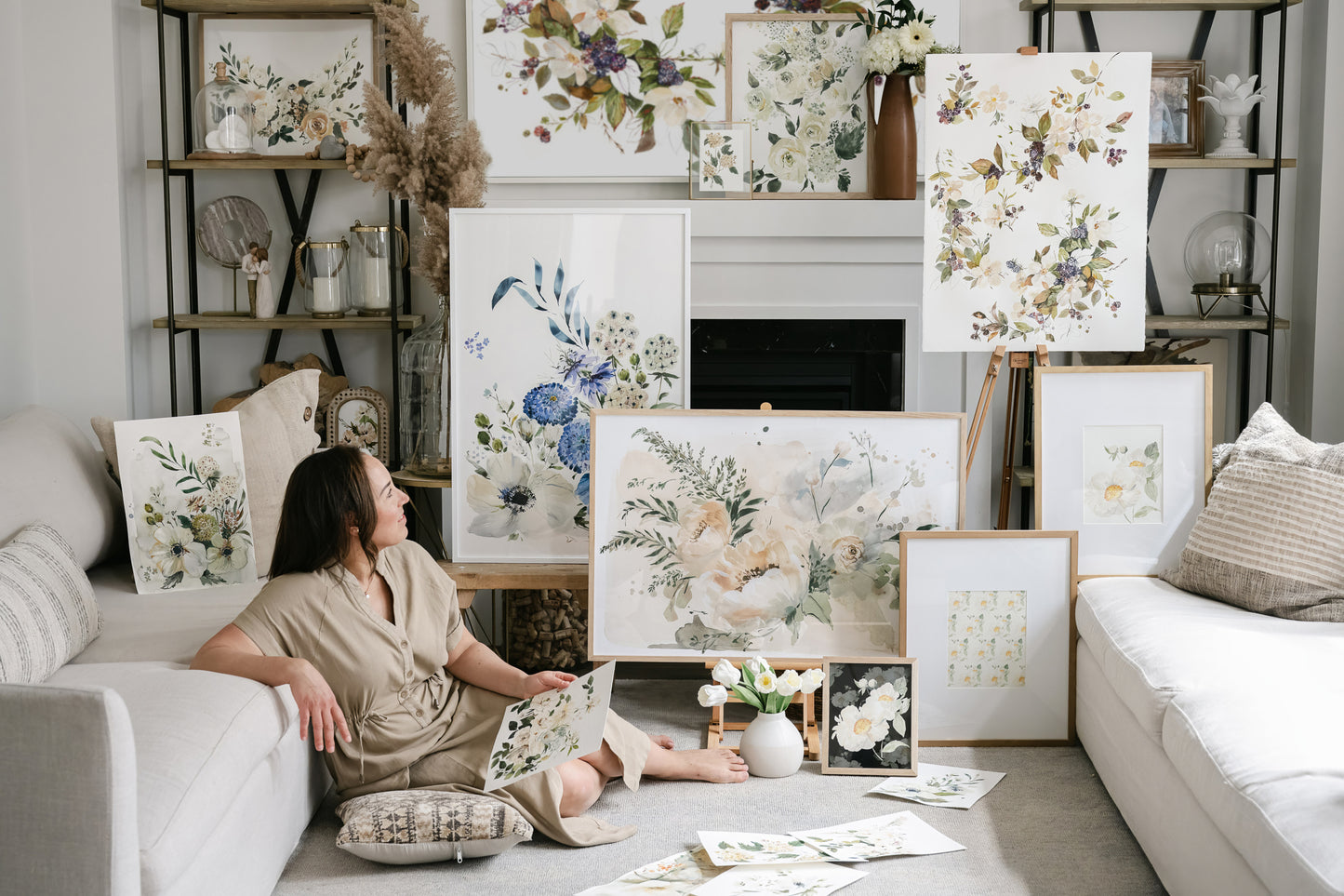Artist surrounded by beautiful floral artworks and home decor